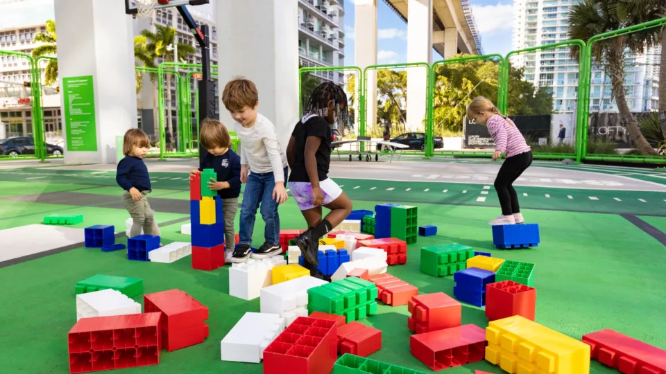 Children playing with large building blocks at the Urban Gym area of the Underline in Miami, FL